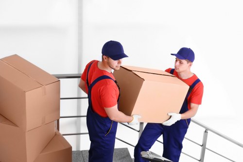 Unloading boxes and home furnishings into a new Kentishtown property