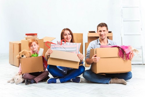 Man and van removals team loading furniture in Kentishtown